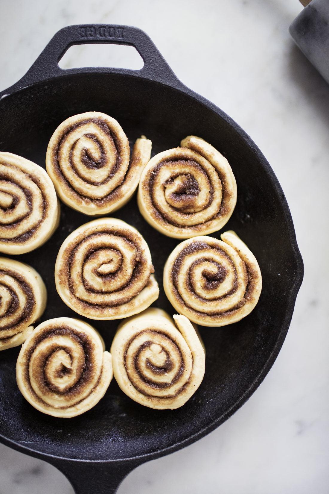 Golden cookie butter sweet rolls glazed and fresh from the oven, made with LorAnn Cookie Butter Bakery Emulsion