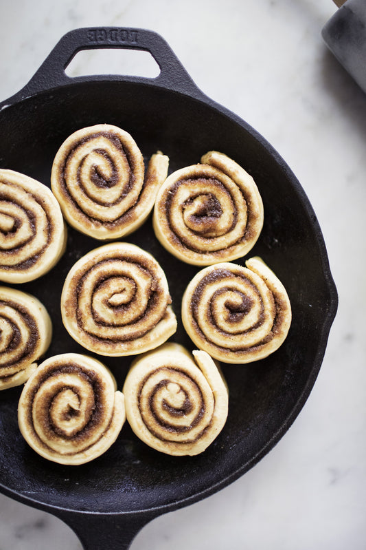 Golden cookie butter sweet rolls glazed and fresh from the oven, made with LorAnn Cookie Butter Bakery Emulsion