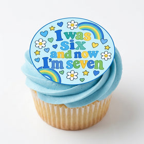 I Was Six Now I'm Seven Boys edible topper on blue buttercream cupcake