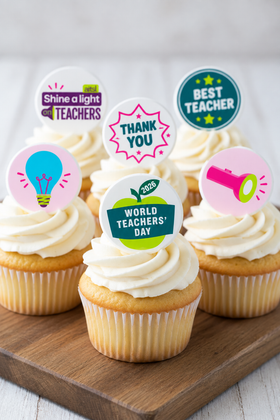 World Teachers' Day cupcake toppers on vanilla cupcakes wooden board